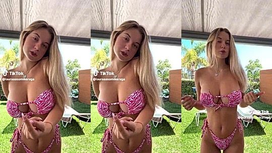 Laura Sommaruga easing her big tits in pink bikini
