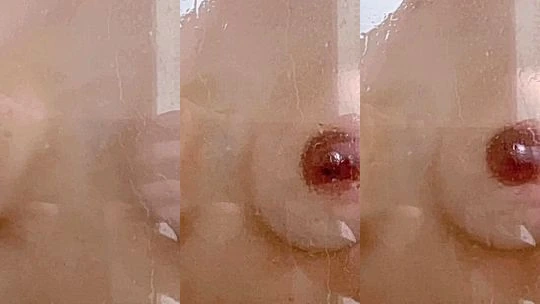Ploytigerstam pressing her naked tits against shower glass