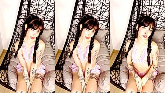 Mia Yokai teasing her small tits in pink lingerie