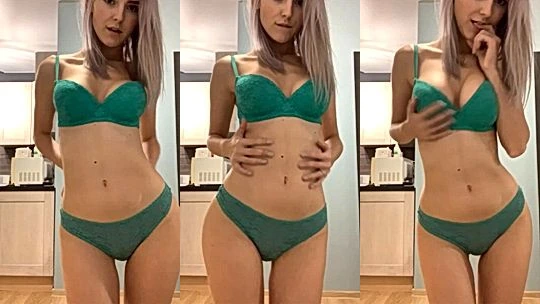 Eva Elfie tasing her naked body in green lingerie