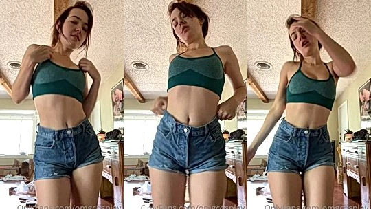 OMGCosplay teasing her sexy body in short jeans