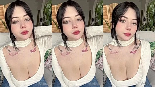 Alina Becker teasing her big tits in low-cut dress