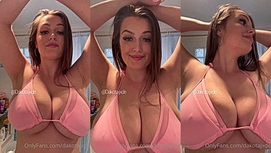 Dakota Jade teasing her big tits in pink lingerie