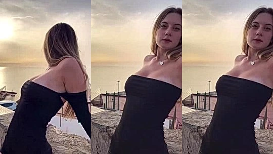 Laura Sommaruga teasing her big tits in black dress
