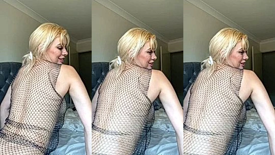 Bree Louise teasing her chainmail lingerie in the bedroom