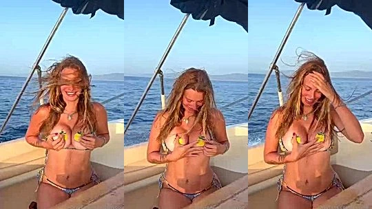 Darja Sobakinskaja teasing her big bikini tit in a boat