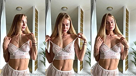 Nancy Ace flashing her perky tits in the mirror