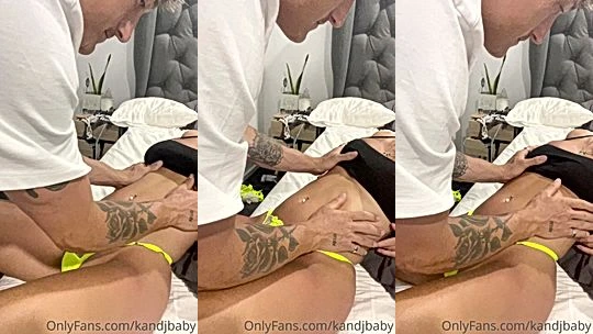 kandjbaby massaging her hot body in bed
