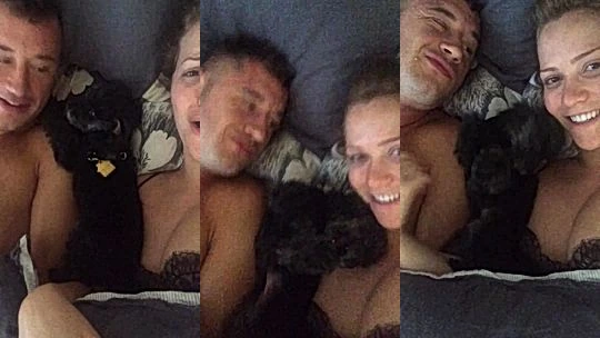 Mia Malkova playing with her dog naked in bed