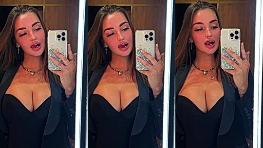 Mary Nabokova teasing her big tits in black bodysuit