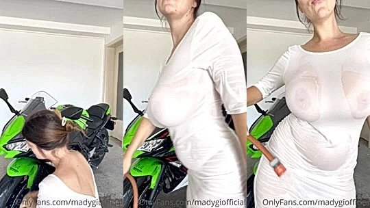 Mady Gio teasing her sexy body in see-through dress by a bike