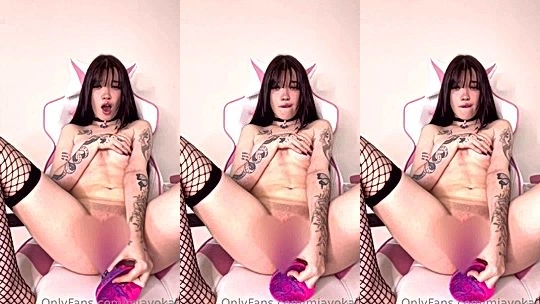 Mia Yokai fucking a pink dildo in latex cosplay