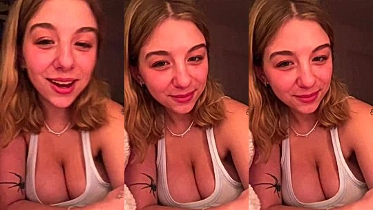 Lynntoria showing off her deep cleavage in the bedroom