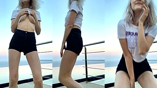 Eva Elfie playing with her big tits by the beach