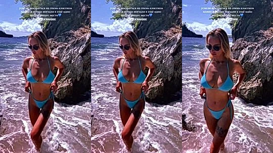 Mary Nabokova teasing her blue bikini on the beach