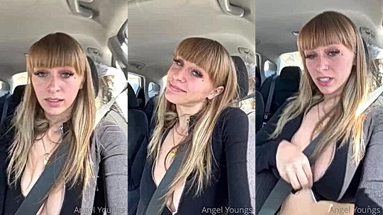 Angel Youngs teasing her deep cleavage in the car