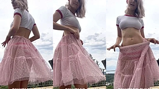 Eva Elfie teasing her sexy body in her see-through skirt outdoors