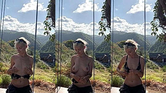 Eva Elfie teasing her naked big tits up in the mountains