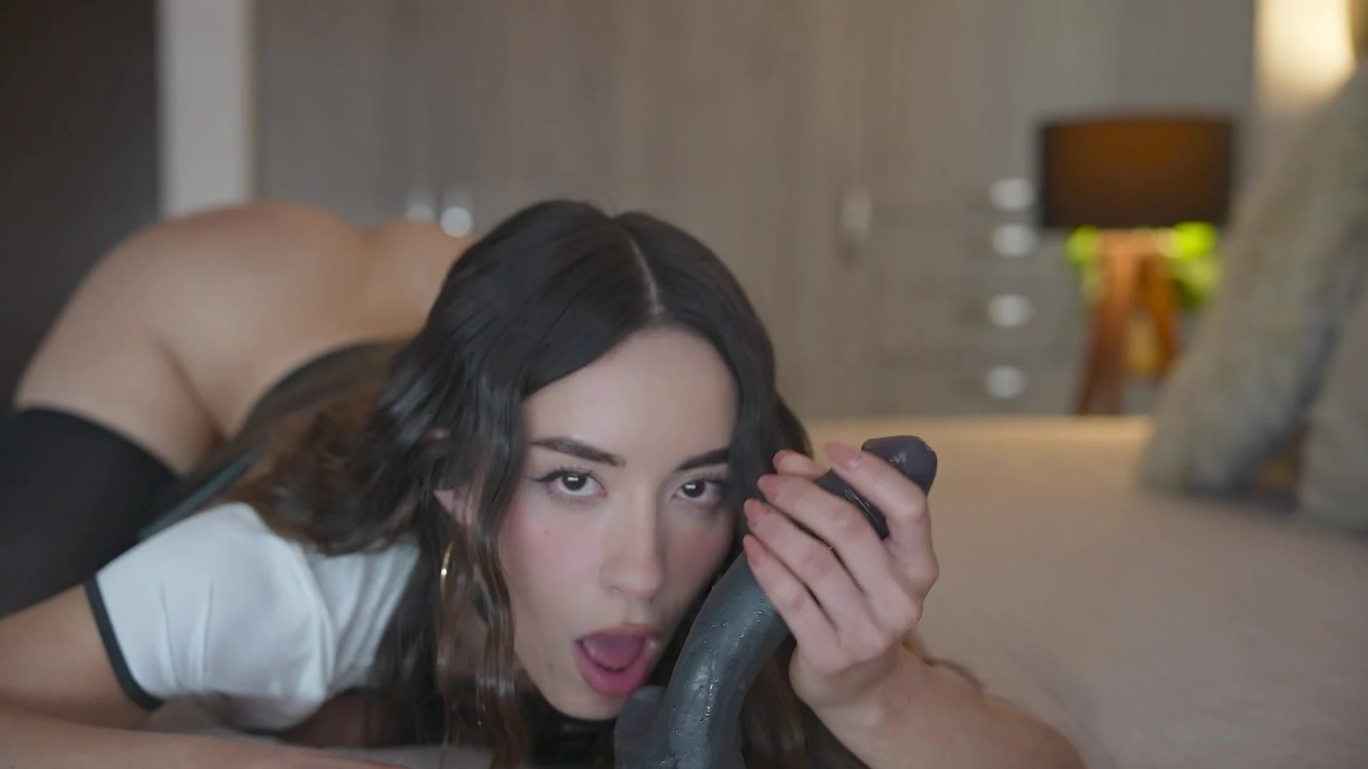 Eimigirl sucking a huge black dildo