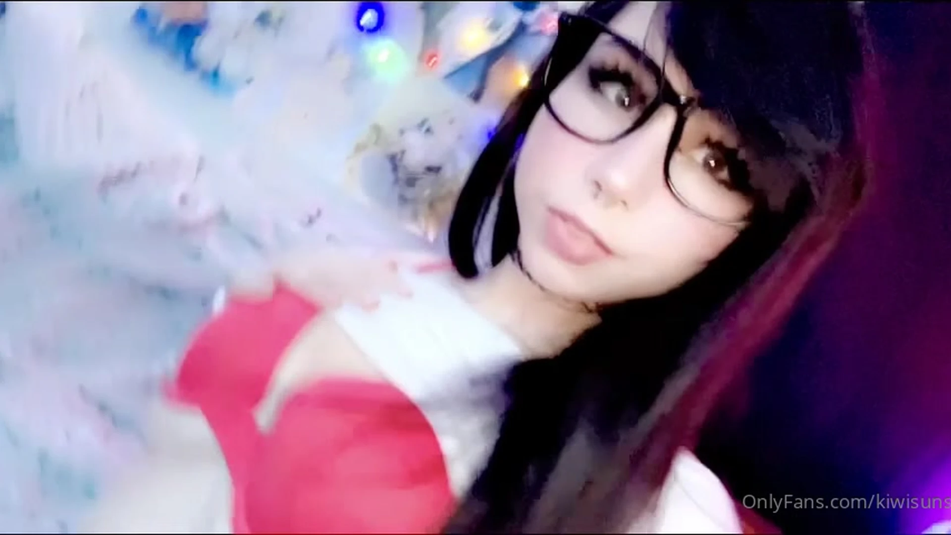 Kiwi Sunset teasing her sexy red bra by christmas tree