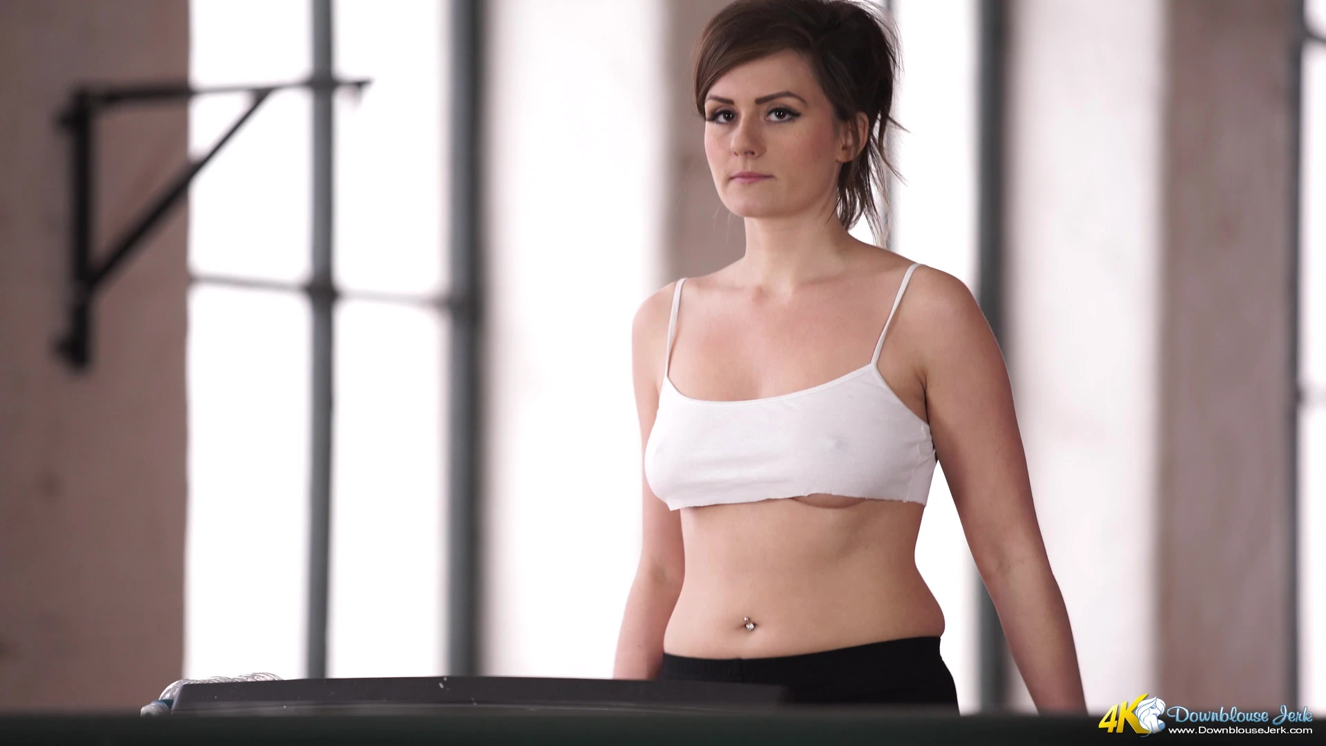 Mikaela Pascal teasing her perky tits on a threadmill