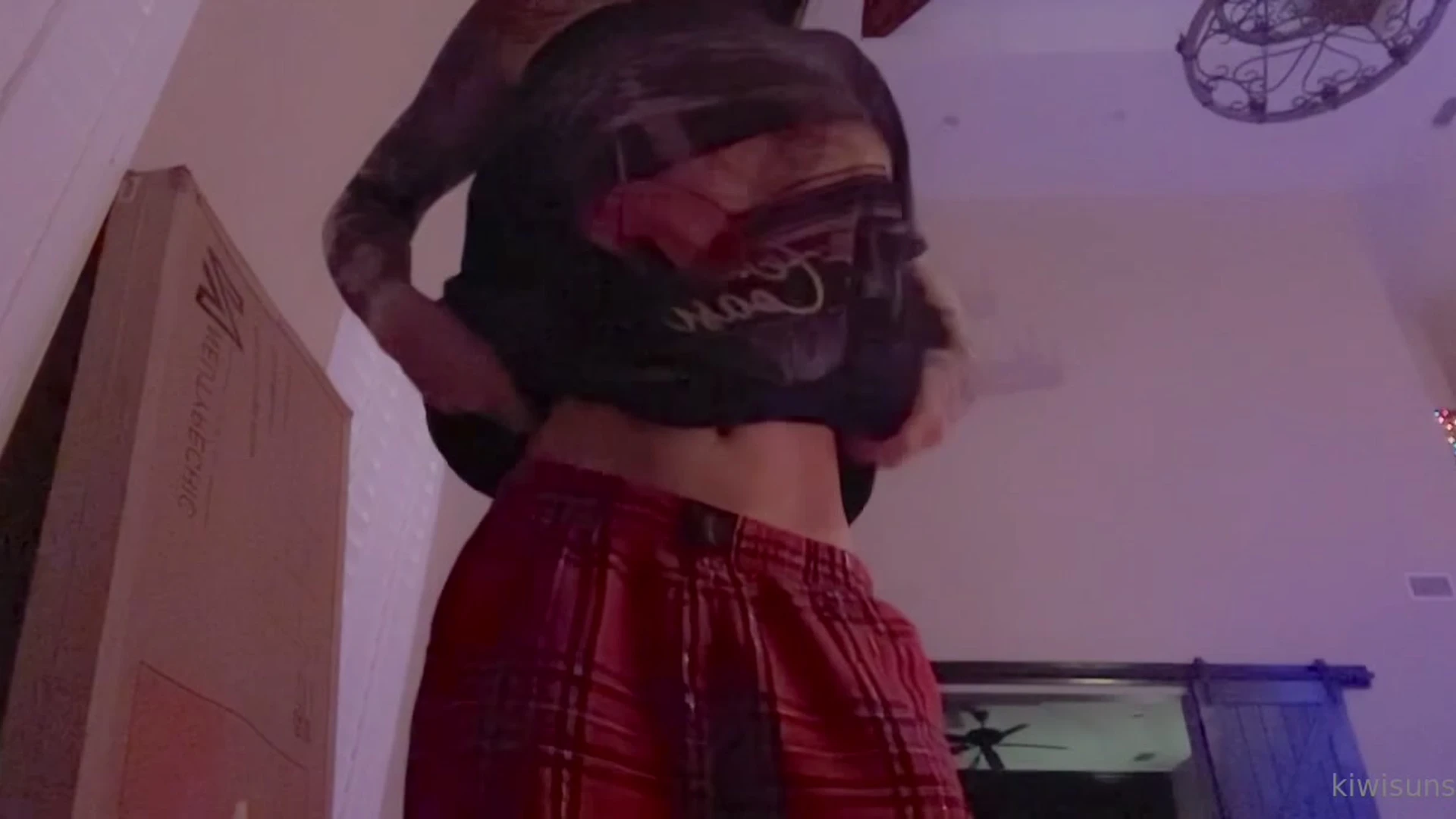 hot slut Kiwi Sunset flashing her naked perky tits in the bedroom
