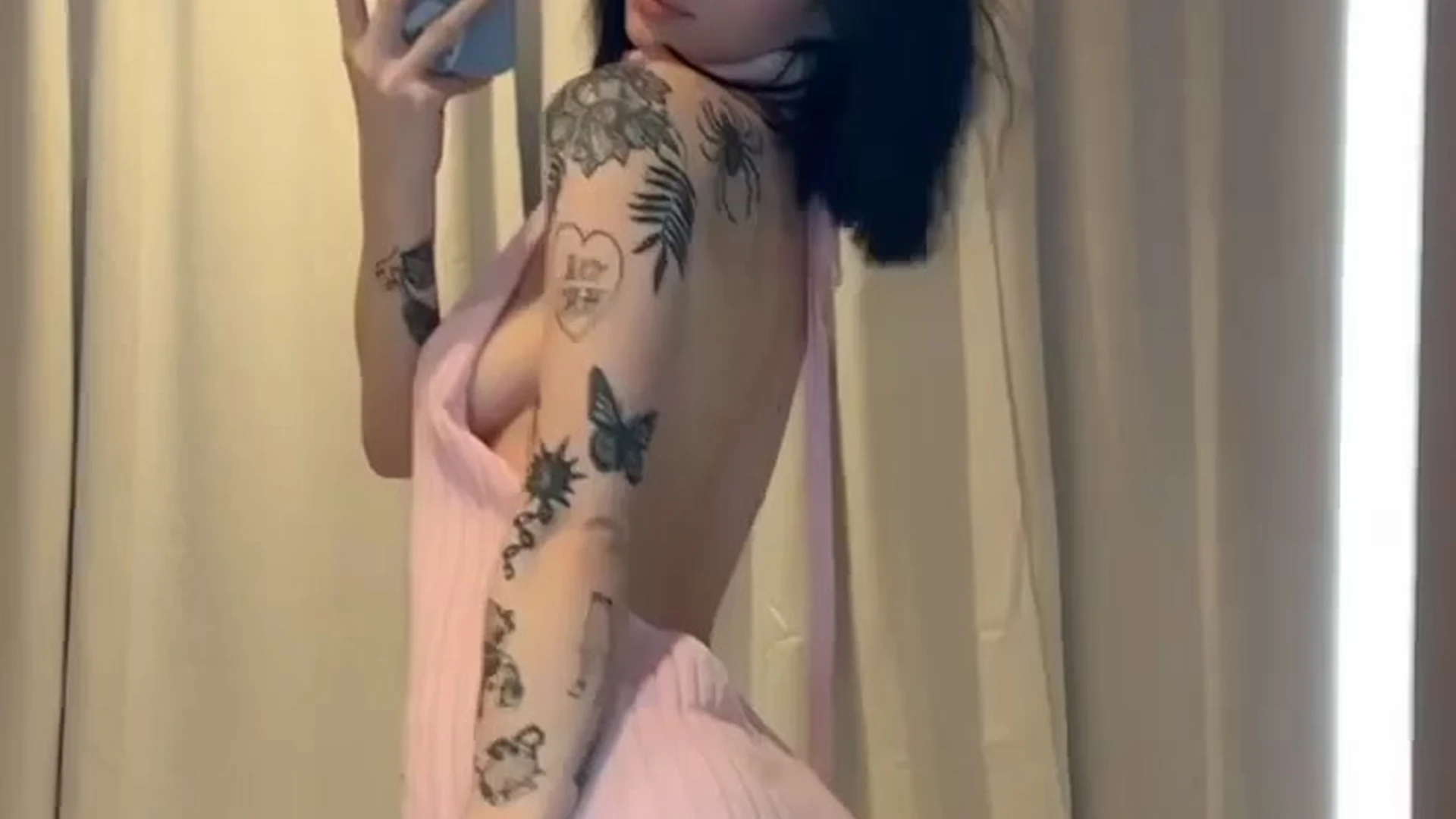 Noemiexlili showing off her sexy sweater in the mirror