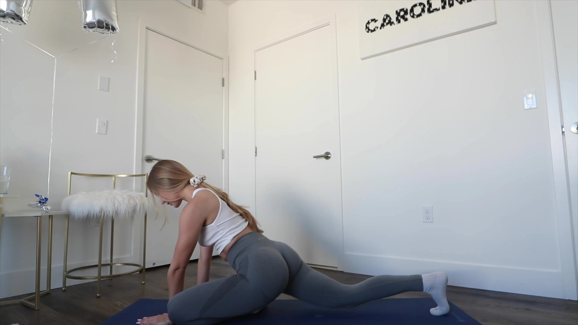 Caroline Zalog doing yoga in tight leggings