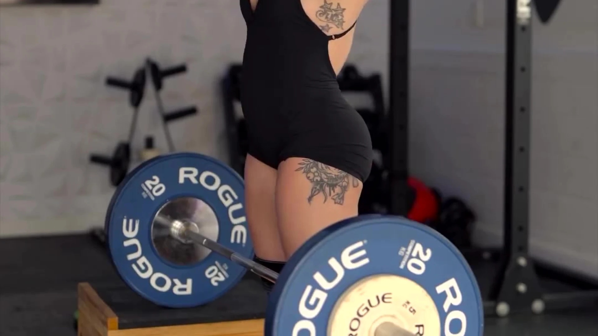 Kristin Pope showing off her fit body while lifting weights