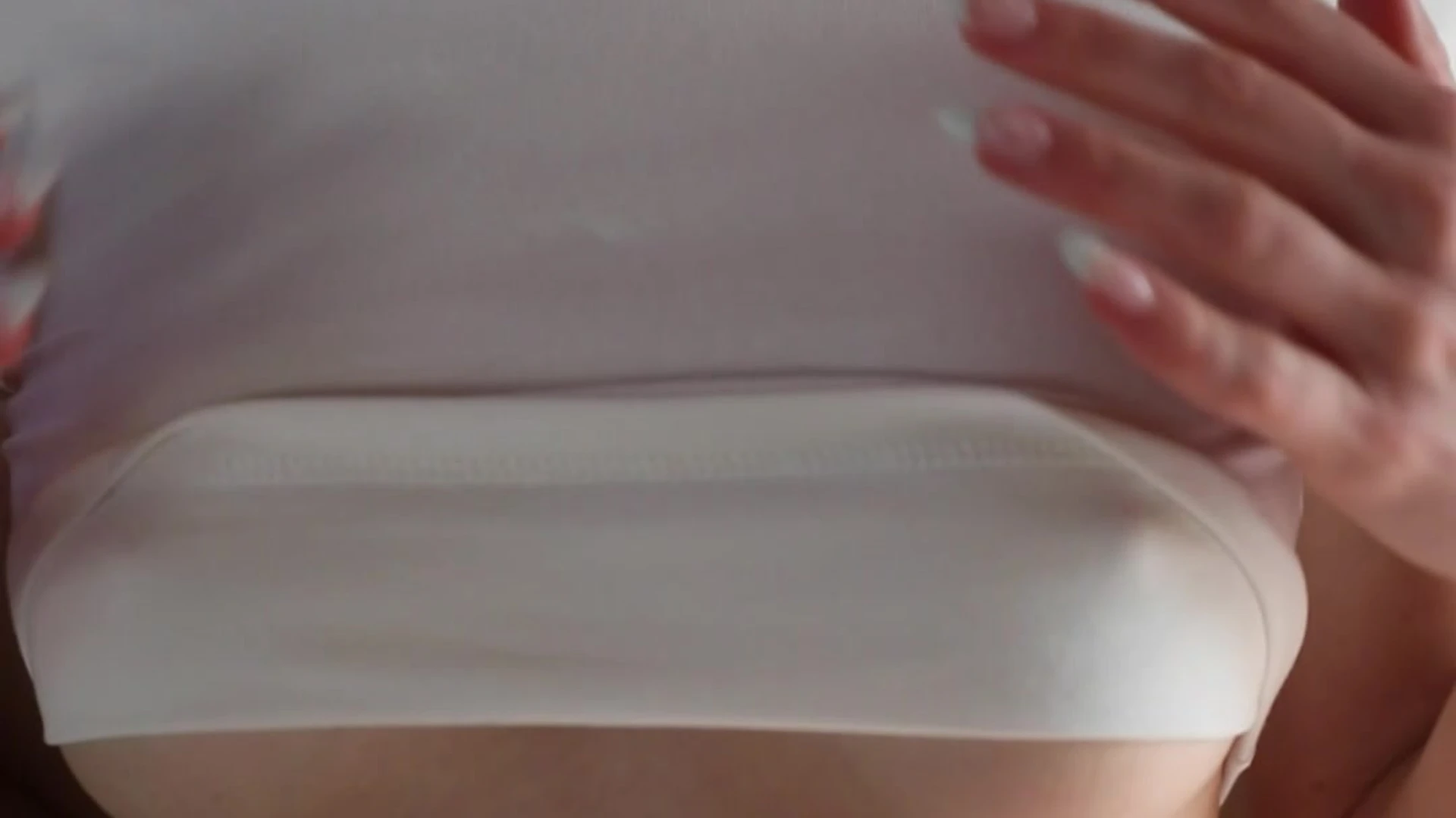 Caroline Zalog teasing her perky nipples in her white top