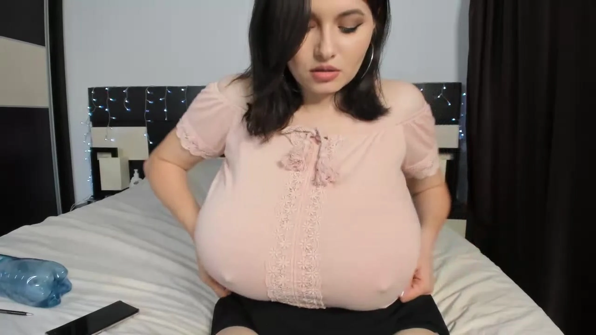 Busty Ema teasing her big tits inher office wear