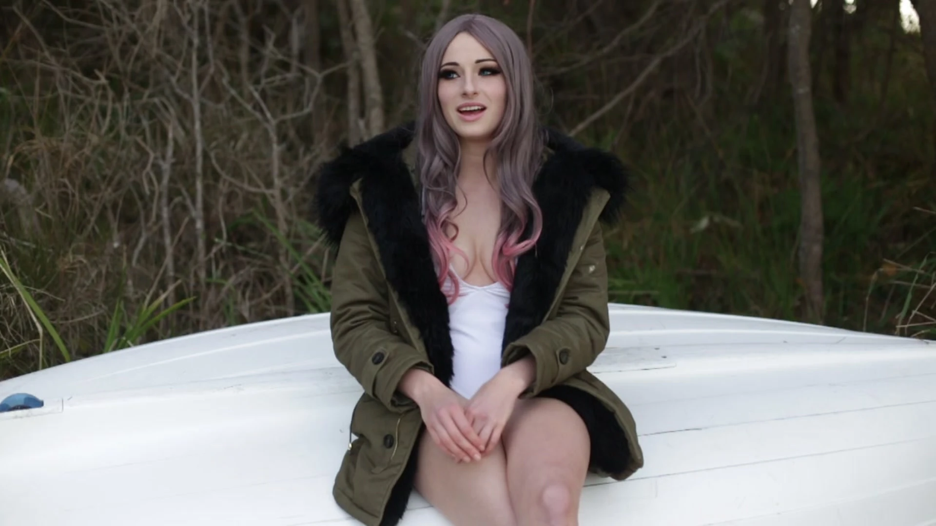 Kayla Erin playing in the snow in her swimsuit