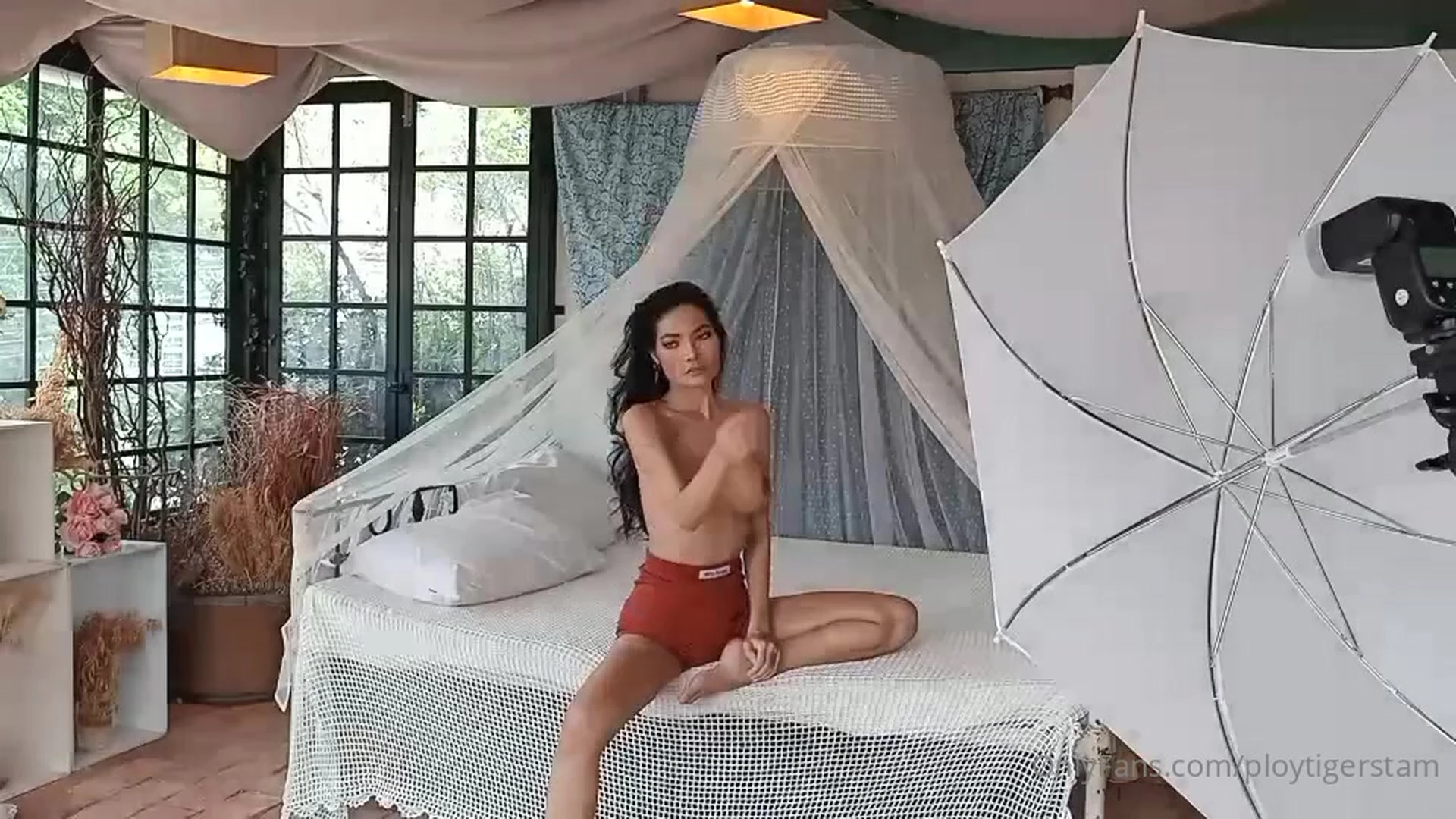 Ploytigerstam teasing her naked tits on photoshoot