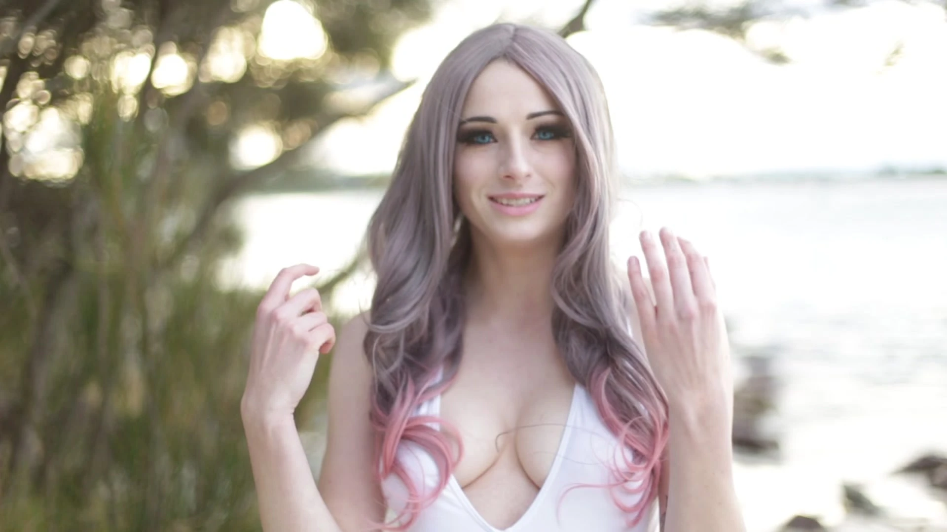 Kayla Erin teasing her swimsuit by the seaside