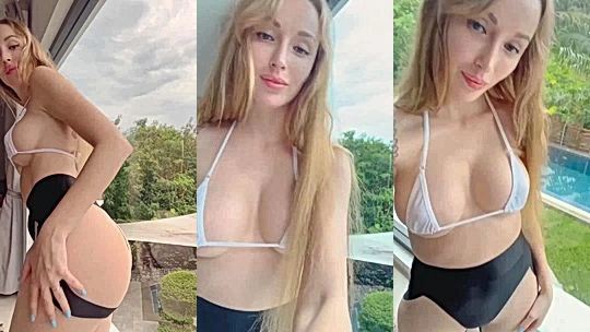 Lera Himera teasing her perky tits in white see-through lingerie by the window