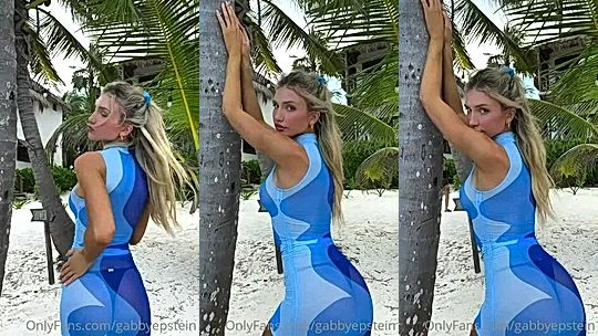 Gabby Epstein teasing her sexy blue mini skirt on the beach