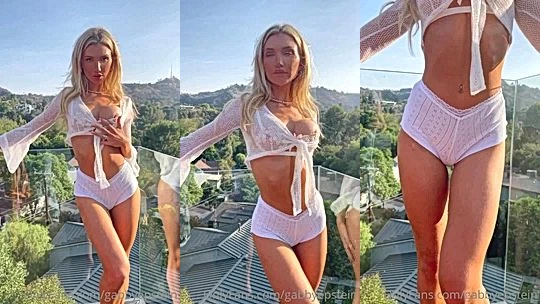 Gabby Epstein teasing her white lingerie outdoors on the balcony