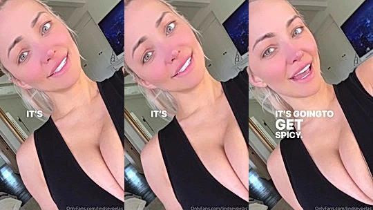 Lindsey Pelas teasing her big tits in her black low-cut dress