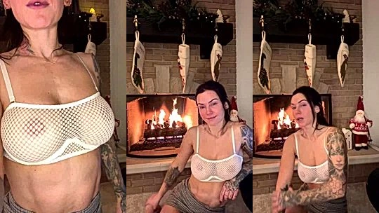 Kayla Lauren teasing her perky tits by the fire place