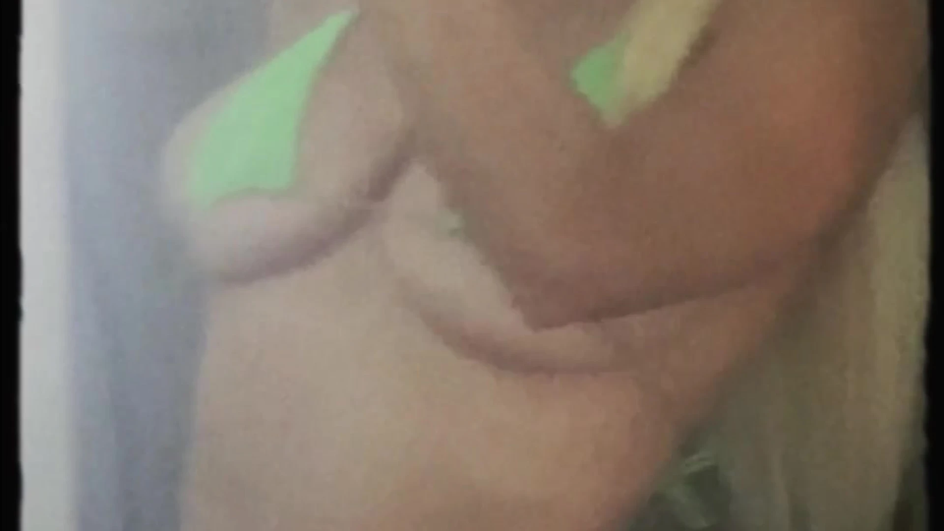 Lindsey Pelas showing off her big tits in green bikini